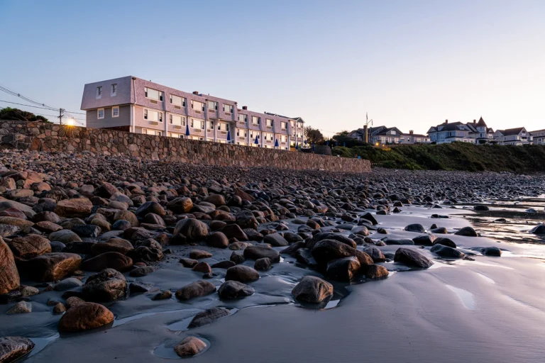 The Cutty Sark Motel overlooking Long Sands Beach in York Beach, Maine at sunset.