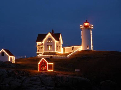 Holiday lights display at Nubble Lighthouse in York, Maine during the annual Lighting of the Nubble event.